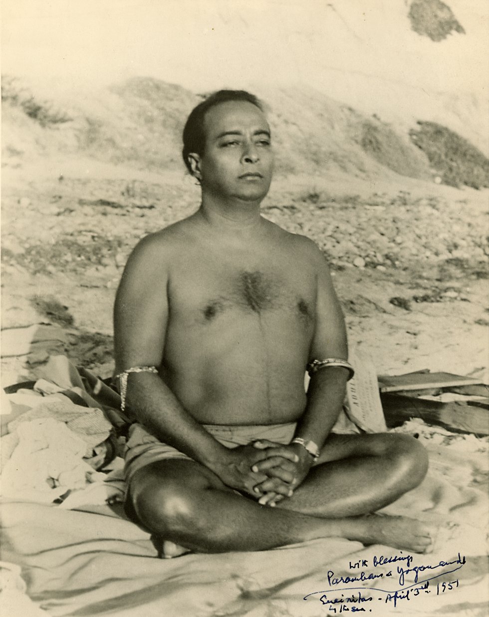 Paramhansa Yogananda meditating by the ocean